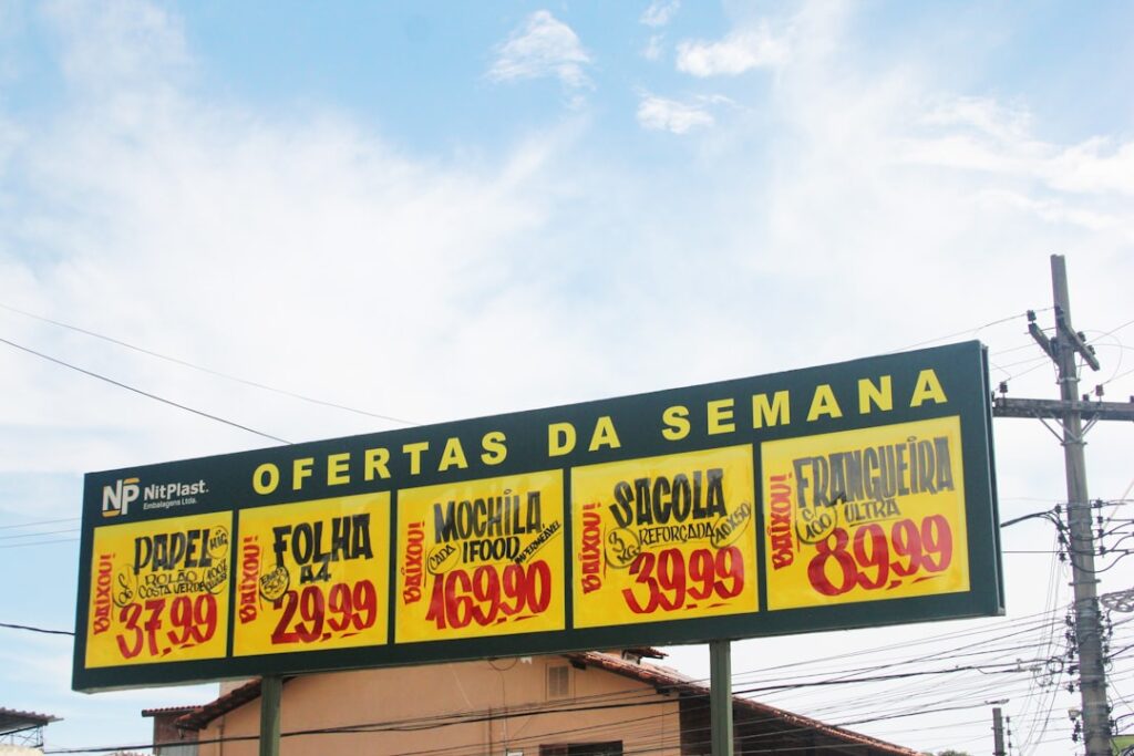 Billboard displays weekly sale prices for various items.