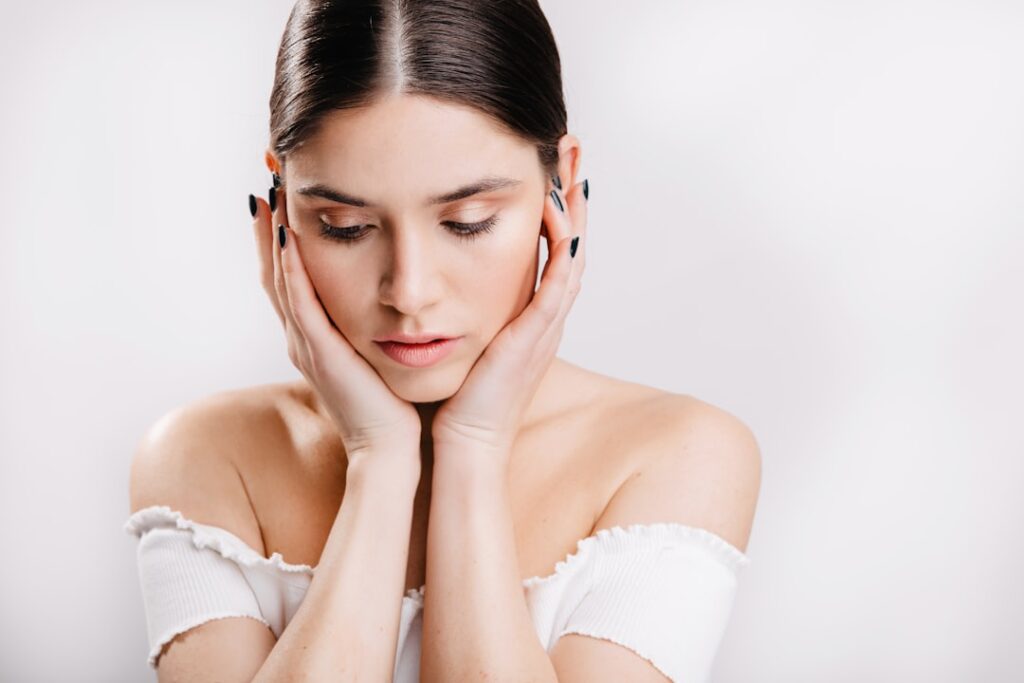A woman with her hands on her face